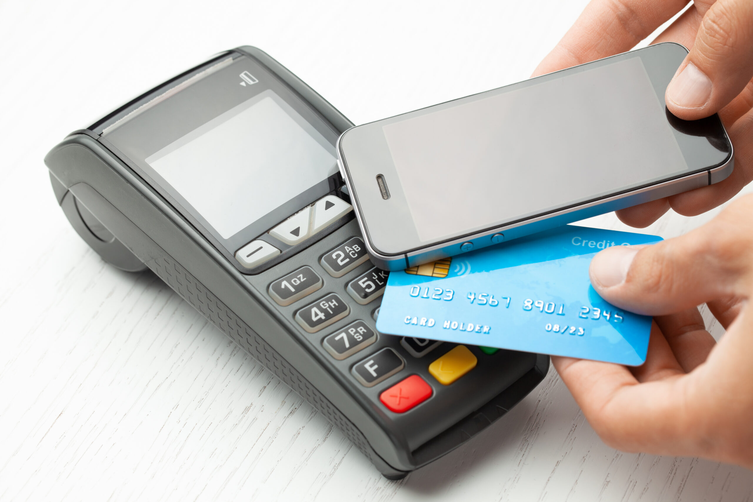 Contactless payment by credit card and smartphone phone. POS terminal NFC payment. Concept of how to choose payment method for shopping in a store.