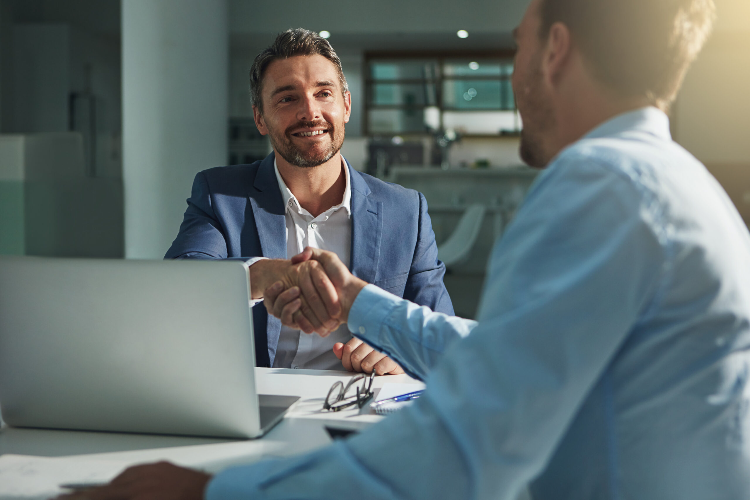 Business people, handshake and interview success or recruitment, employment and hiring in office. Corporate, men and executive shaking hands with new employee or collaboration on deal or partnership click to cancel, FTC, unsubscribe